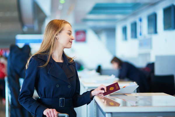 woman with passport at airport